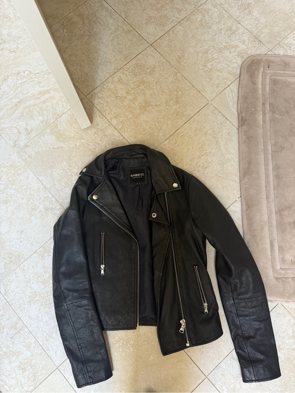 Barney’s black leather jacket
